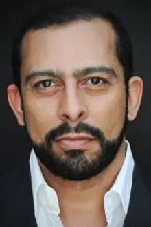 Emilio Doorgasingh como: William Sheehan / Chet Huntley / Howard Austen