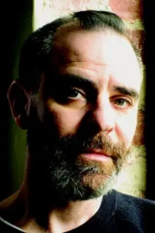 David Rakoff como: The Director