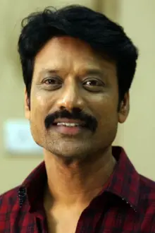 S. J. Suryah como: Jackie Pandian / Madhan Pandiyan