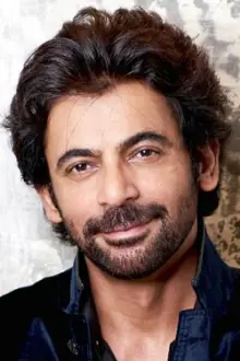 Sunil Grover como: Dr. Mashoor Gulati / Amitabh Bachchan