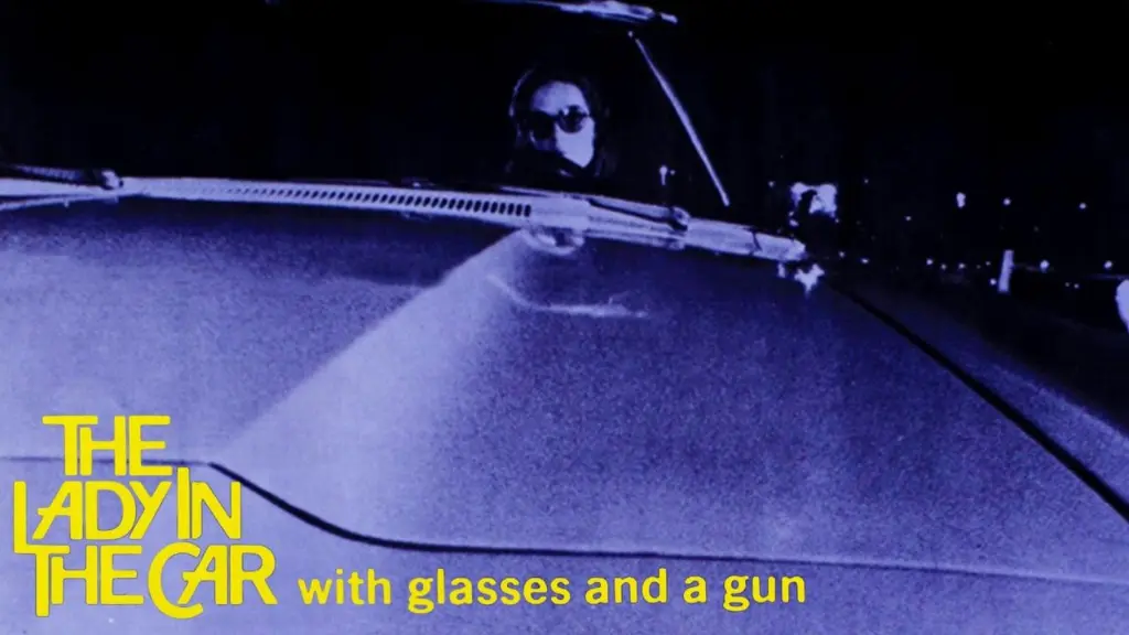 The Lady in the Car with Glasses and a Gun